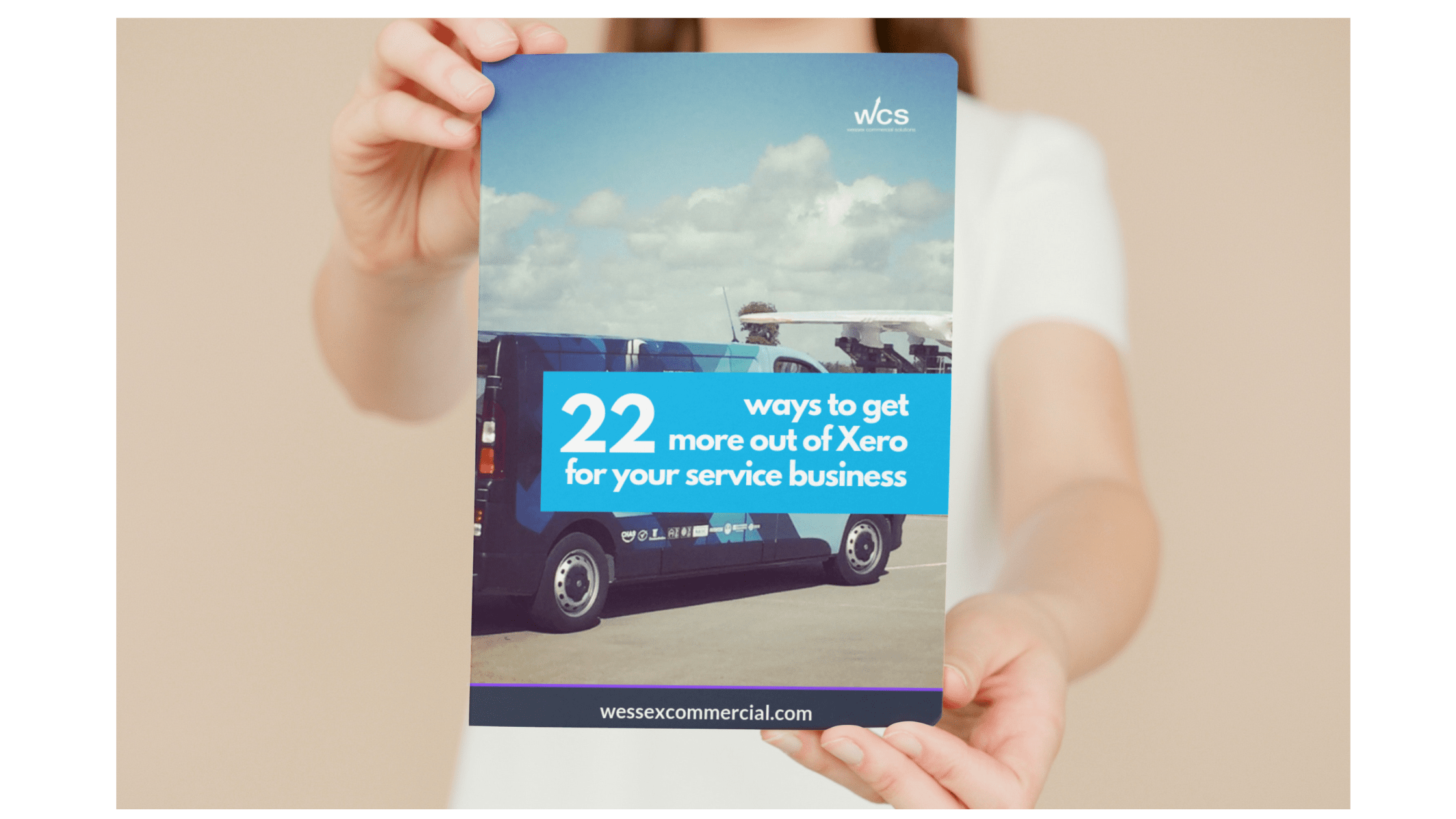 Image of person holding ebook 22 ways to get more out of Xero for your service business